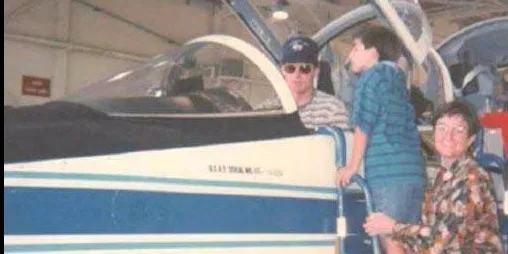 (Nick on the ladder with Katie and his brother-in-law Scott Reagan, the pilot)