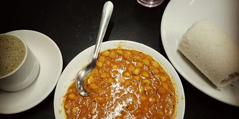 Meal of Kadala or Chickpea Curry and Puttu at India Coffee House