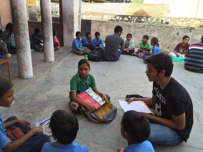 A Team of Gram Vikas educating  the children at Government  School premises.