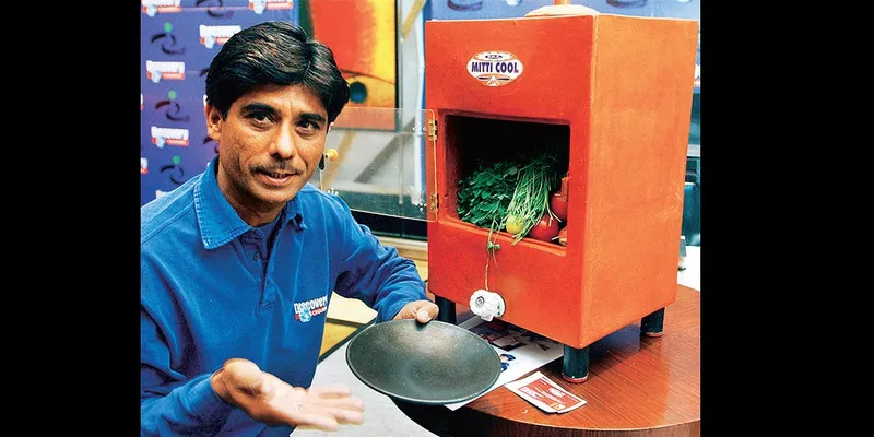  Mansukhbhai with his  Mitticool Refrigerator and Non stick tava.