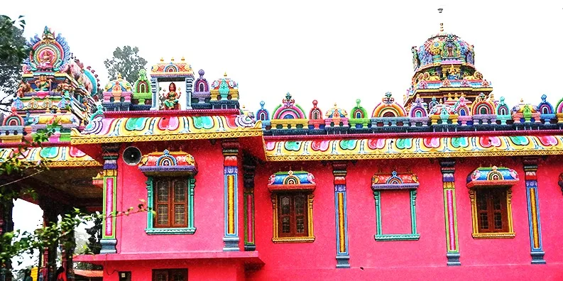 Photo #4: It was raining in Coorg and the temple is still so beautiful. I liked to appreciate how intense the pink color was.