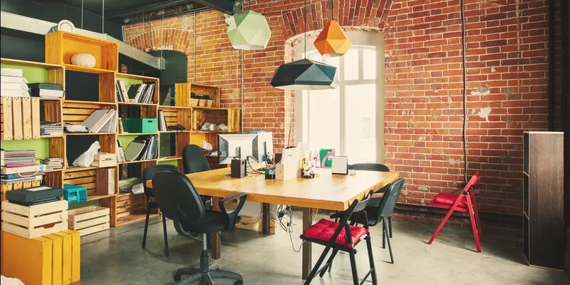 The texture from the brick wall, crate storage, decorative lamps, and chairs stimulates our sense of touch.