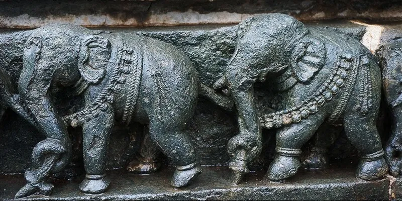 Photo #4: The temples in Belur have scenes of epic elephants carved in stone.