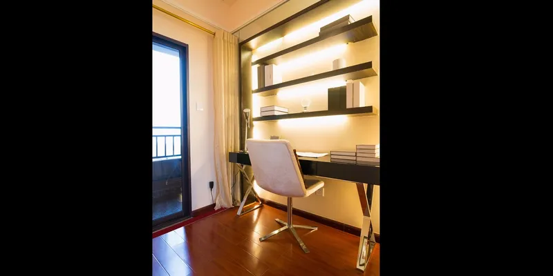 This simple office area became awesome with the addition of fluorescent lamps below each hanging shelf.
