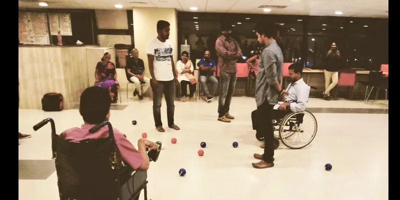 That's Rajiv and myself on the right staring at the boccia balls to evaluate the winner 